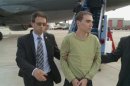 Handout of Luka Rocco Magnotta, 29, accused of killing Chinese student, Jun Lin being escorted off a plane from Germany by Montreal police in Montreal