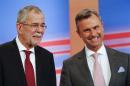 Presidential candidates van der Bellen and Hofer react during a TV debate in Vienna