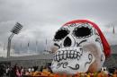 The Day of the Dead takes place between November 1-2 every year, when Mexicans visit cemeteries to pay respects to their late relatives, bringing them food and drinks in a centuries-old tradition mixing pre-Hispanic and Catholic beliefs