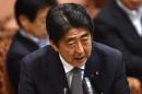 Japanese Prime Minister Shinzo Abe pushed the laws through after days of tortuous debate that at times descended into physical scuffles in parliament