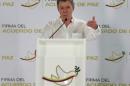Colombia's President Santos gestures during a news conference in Cartagena