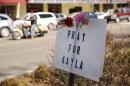 A sign for Kayla Mueller is displayed along a main street in Prescott