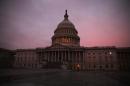 The morning sun begins to rise in front of the US Capitol, on March 11, 2014 in Washington, DC