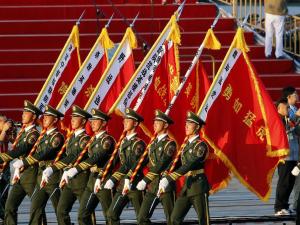Paramilitary policemen carrying flags prepare in front &hellip;