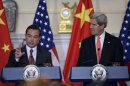 Secretary of State John Kerry, right, listens as Chinese Foreign Minster Wang Yi, left, speaks before their bilateral meeting at the State Department in Washington, Thursday, Sept. 19, 2013. Syria and North Korea as well as other issues were to be discussed. (AP Photo/Susan Walsh)