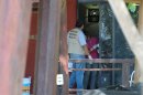 Police investigators work to obtain fingerprints on a door at the home where masked, armed men broke in, in Acapulco, Mexico, Tuesday Feb. 5, 2013. According to the mayor of Acapulco, five masked men burst into this house that Spanish tourists had rented on the outskirts of Acapulco, in a low-key area near the beach, and held a group of six Spanish men and one Mexican woman at gunpoint, while they raped the six Spanish women before dawn on Monday. (AP Photo/Bernandino Hernandez)