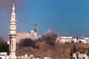 In this image made from amateur video released by the Ugarit News and accessed Monday, July 2, 2012, black smoke leaps the air from shelling near a mosque in Talbiseh, the central province of Homs, Syria. The head of the Arab League urged Syria's exiled opposition to unite Monday, saying they must not squander the opportunity to overcome their differences as Western efforts to force President Bashar Assad from power all but collapse. (AP Photo/Ugarit News via AP video) TV OUT, THE ASSOCIATED PRESS CANNOT INDEPENDENTLY VERIFY THE CONTENT, DATE, LOCATION OR AUTHENTICITY OF THIS MATERIAL