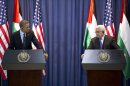 President Barack Obama, left, and Palestinian President Mahmoud Abbas, participate in a joint news conference at the Muqata Presidential Compound, in the West Bank town of Ramallah, Thursday, March 21, 2013. (AP Photo/Carolyn Kaster)