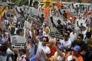 Supporters of arrested opposition leader Leopoldo Lopez, take part in an opposition rally to mark the first month of his detention in Los Teques, near Caracas, on March 18, 2014