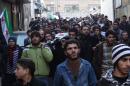 Mourners attend the funeral of men killed during battles with members of the al-Qaeda-linked group Islamic State of Iraq and the Levant (ISIL), in the northern city of Aleppo, on January 8, 2014