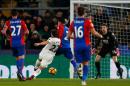 Swansea City's Angel Rangel shoots to score their second goal against Crystal Palace in south London on January 3, 2017