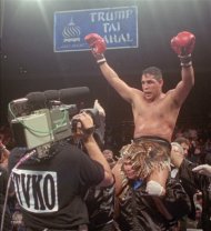 FILE - This June 22, 1996, file photo shows Hector "Macho" Camacho being lifted into the air after his unanimous decision over Roberto Duran in an IBC middleweight title fight at the Trump Taj Mahal Casino Resort in Atlantic City, N.J. Police in the Puerto Rican city of Bayamon say they found drugs inside the car in which former champion boxer Camacho was shot and critically wounded. Camacho was in critical condition Wednesday, Nov. 21, 2012, at the Centro Medico trauma center in San Juan. (AP Photo/Donna Connor, File)