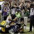 Officials signal a touchdown by Seattle Seahawks wide receiver Golden Tate, obscured, on the last play of an NFL football game against the Green Bay Packers, Monday, Sept. 24, 2012, in Seattle. The Seahawks won 14-12. (AP Photo/Stephen Brashear)