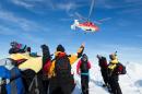 Image taken by expedition doctor Andrew Peacock of www.footloosefotography.com on January 2, 2014 shows a helicopter from the Chinese icebreaker Xue Long above passengers from the stranded Russian ship MV Akademik Shokalskiy in Antarctica