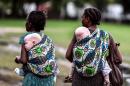 This image courtesy of the Milliyet Daily shows women carrying their albino children on May 5, 2014, in Dar es Salaam, Tanzania