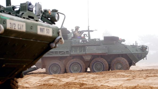 An armored fighting vehicle IAV Stryker of the US Cavalry Regiment 2nd subdivision is seen during a partner training with Latvian and Canadian soldiers at the Adazi military training area in Latvia on February 26, 2015
