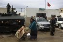 An armoured personnel carrier patrols, near police station in Dawar Hicher near the capital Tunis