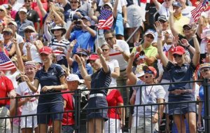 Korda, Pressel and Creamer of Team USA encourage fans during the Friday afternoon four-ball matches at the Solheim Cup in Parker