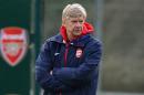 Arsenal's French manager Arsene Wenger supervises a training session at the club's training ground in north London, on November 25, 2013
