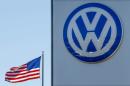FILE PHOTO: An American flag flies next to a Volkswagen car dealership in San Diego, California