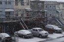 Cars are seen covered by snow during the arrival of Nor'easter, also known as a northeaster storm, in Jersey City, New Jersey