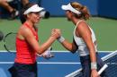 Johanna Konta of the United Kingdom shakes hands with Garbine Muguruza of Spain during their 2015 US Open Women's Singles round 2 match at the USTA Billie Jean King National Tennis Center September 3, 2015 in New York