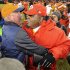 Denver Broncos head coach John Fox, left, greets Kansas City Chiefs coach Romeo Crennel at the end of an NFL football game, Sunday, Dec. 30, 2012, in Denver. Denver won 38-3. (AP Photo/Jack Dempsey)