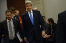 US Secretary of State John Kerry walks to a meeting with Senate Democrats on April 14, 2015 in Washington, DC