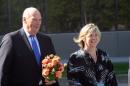 King Harald V of Norway, left, walks with Anchorage Museum CEO Julie Decker on Wednesday, May 27, 2015, after arriving at the museum for a tour in Anchorage, Alaska. The king's visit to the United States included stops in Washington state and Alaska. (AP Photo/Mark Thiessen)