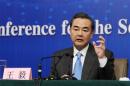 China's Foreign Minister Wang speaks during a news conference as part of the National People's Congress in Beijing