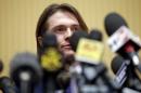Sollecito smiles as he leads a news conference in Rome