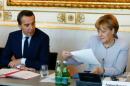 Austrian Chancellor Kern and German Chancellor Merkel attend the summit "Migration along the Balkan route" in Vienna