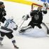 Kings' goalie Jonathan Quick makes a save in the final seconds of their game as Greene and Sharks' Pavelski look on during Game 7 of their Western Conference semi-final hockey playoff in Los Angeles