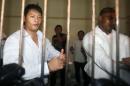 Australian Andrew Chan and Myuran Sukumaran wait in a temporary cell for their appeal hearing in Denpasar District Court in Indonesia's resort island of Bali