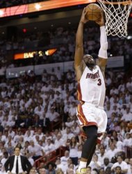 Miami Heat's Dwyane Wade (3) dunks the ball against the San Antonio Spurs during the second half in Game 7 of the NBA basketball championships, Thursday, June 20, 2013, in Miami. (AP Photo/Lynne Sladky)