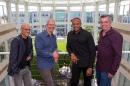 In this image provided by Apple, from left to right, music entrepreneur and Beats co-founder Jimmy Iovine, Apple CEO Tim Cook, Beats co-founder Dr. Dre, and Apple senior vice president Eddy Cue pose together at Apple headquarters in Cupertino, Calif., Wednesday, May 28, 2014. Apple is striking a new chord with a $3 billion acquisition of Beats Electronics, a headphone and music streaming specialist that also brings the swagger of rapper Dr. Dre and recording impresario Jimmy Iovine. The announcement on Wednesday comes nearly three weeks after deal negotiations were leaked to the media. (AP Photo/Apple, Paul Sakuma)