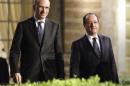 Italian Prime Minister Enrico Letta and French President Francois Hollande walk during a break in their meeting at Villa Madama in Rome