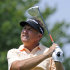 Ken Duke watches his tee shot on the second hole during the final round of the Travelers Championship golf tournament in Cromwell, Conn., Sunday, June 23, 2013. (AP Photo/Fred Beckham)