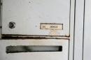 A name on letter box reading "Amimour" is seen at the entrance of an apartment building where Samy Amimour, one of the attackers identified by the police, grew up in the Parisian suburb of Drancy,