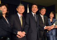Japan's incoming Prime Minister and leader of Liberal Democratic Party (LDP) Shinzo Abe (C) shakes hands with his party's new executives: Seiko Noda (L), Masahiko Komura (2nd L), Shigeru Ishiba (2nd R) and Sanae Takaichi (R) at the LDP headquarters in Tokyo on December 25, 2012. Abe was elected as prime minister by the lower house of parliament on Wednesday