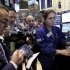 In this Oct. 27, 2011 photo, specialist Jennifer Klesaris (right) works at her post on the floor of the New York Stock Exchange. Global stocks gave up some of their recent gains Monday, Oct. 31, amid concerns over Italy's ability to get a handle on its colossal debt pile, while the yen slid in the wake of another attempt by the Japanese monetary authorities to weaken the currency.(AP Photo/Richard Drew)