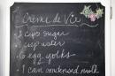 A recipe for Cuban eggnog by Cuban food blogger Marta Darby is written on a small blackboard in her home on Tuesday, Dec. 17, 2013, in Mission Viejo, Calif. Darby will be making a toast to Cuba this year, accompanied with a glass of the rum-based eggnog known as the "creme de vie" or "cream of life." (AP Photo/Jae C. Hong)