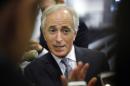 Corker talks to reporters as he arrives for the weekly Republican caucus policy luncheons at the U.S. Capitol in Washington