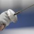 A fencer holds up a foil during a practice session at the ExCel venue before the start of the London 2012 Olympic Games