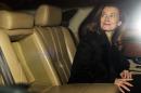 Valerie Trierweiler, the ex-partner of the French President, reacts in a car after arriving at the international airport in Mumbai, early on January 27, 2014, for a humanitarian trip to India
