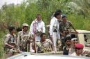 File photo of soldiers loyal to Yemen's President Abd-Rabbu Mansour Hadi riding on the back of a pick-up truck during his visit to the coutry's northern province of Marib