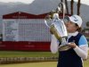Park of South Korea kisses her trophy after winning the Kraft Nabisco Championship golf tournament in Rancho Mirage, California