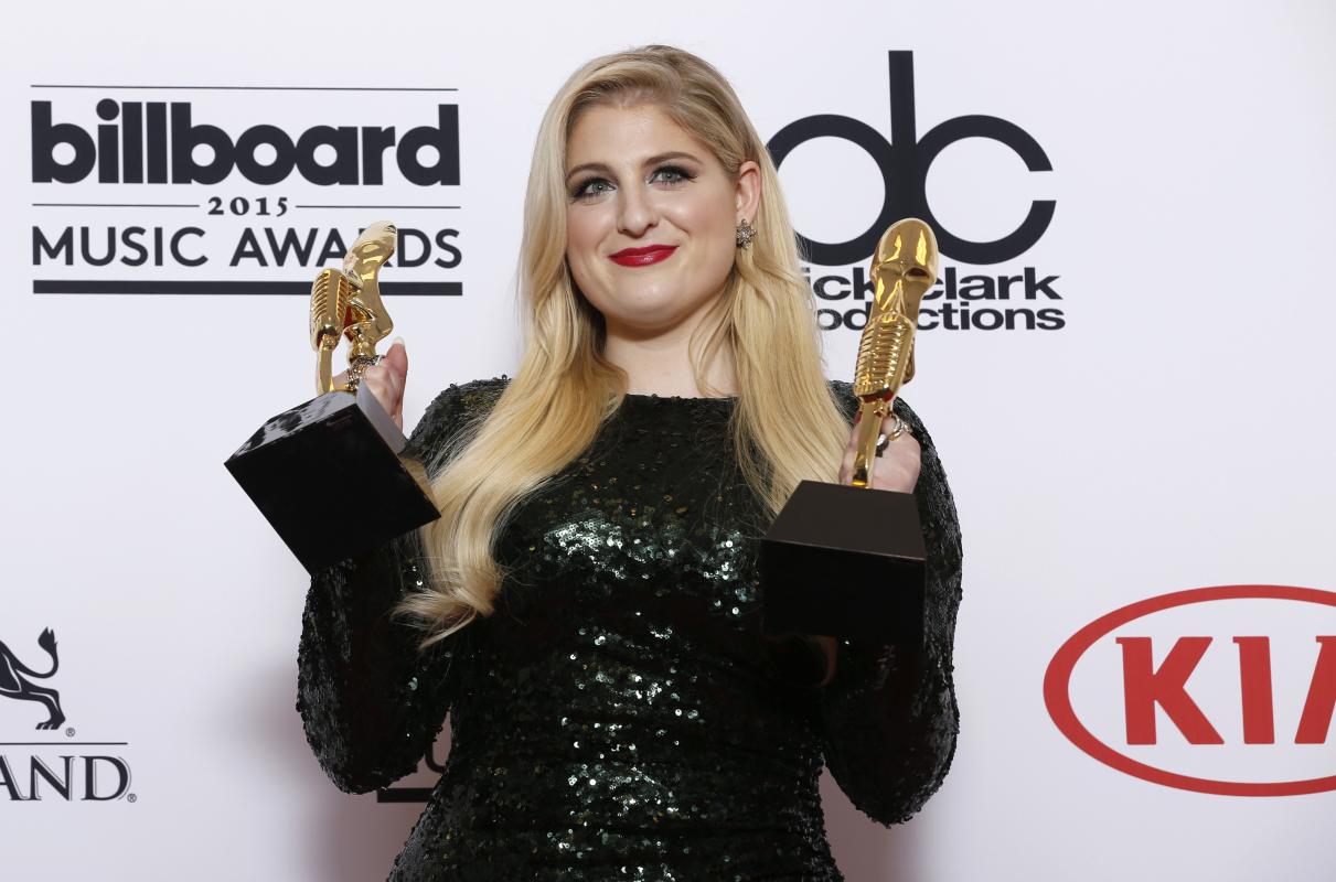 Meghan Trainor poses in the press room with the awards for top hot 100 song for “All About That Bass” and top digital song for “All About That Bass” at the Billboard Music Awards at the MGM Grand Garden Arena on Sunday, May 17, 2015, in Las Vegas. (Photo by Eric Jamison/Invision/AP)