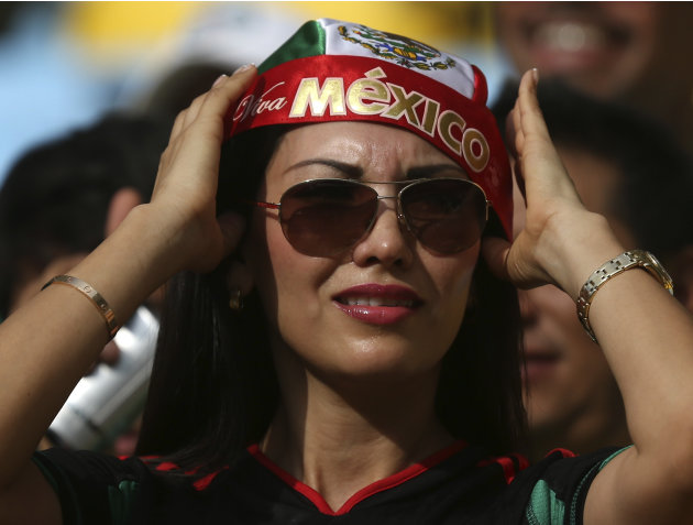 A fan of Mexico waits before the Confederations Cup Group A soccer match between Mexico and Italy at the Estadio Maracana in Rio de Janeiro