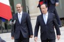France's president Francois Hollande, right, accompanies Syria National Coallition president Ahmed al-Jarba after their meeting at the Elysee Palace in Paris, France, Wednesday, July 24, 2013. (AP Photo/Francois Mori)